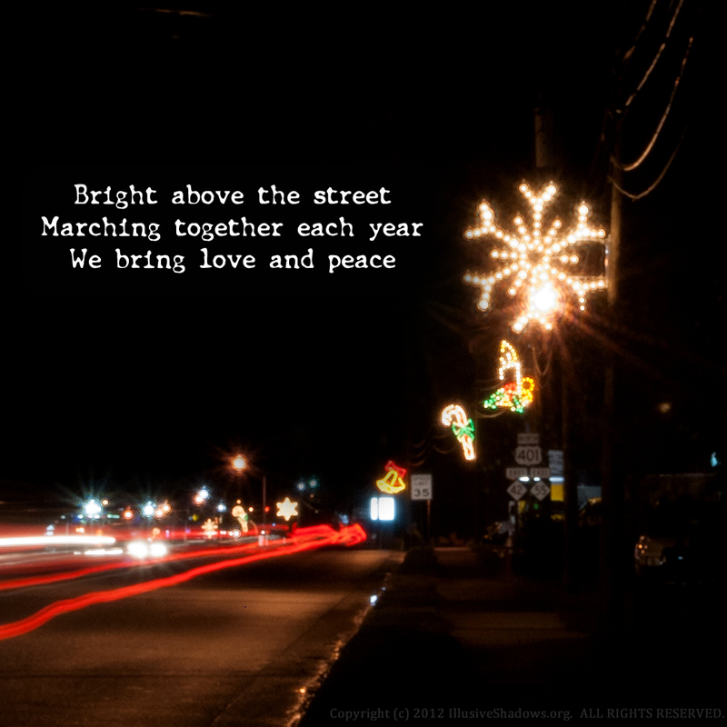 Bright above the street; Marching together each year; We bring love and peace.